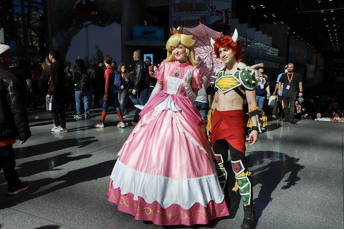 Princess Peach and Bowser cosplayers from Mario universe at the geek convention Trickster Magazine